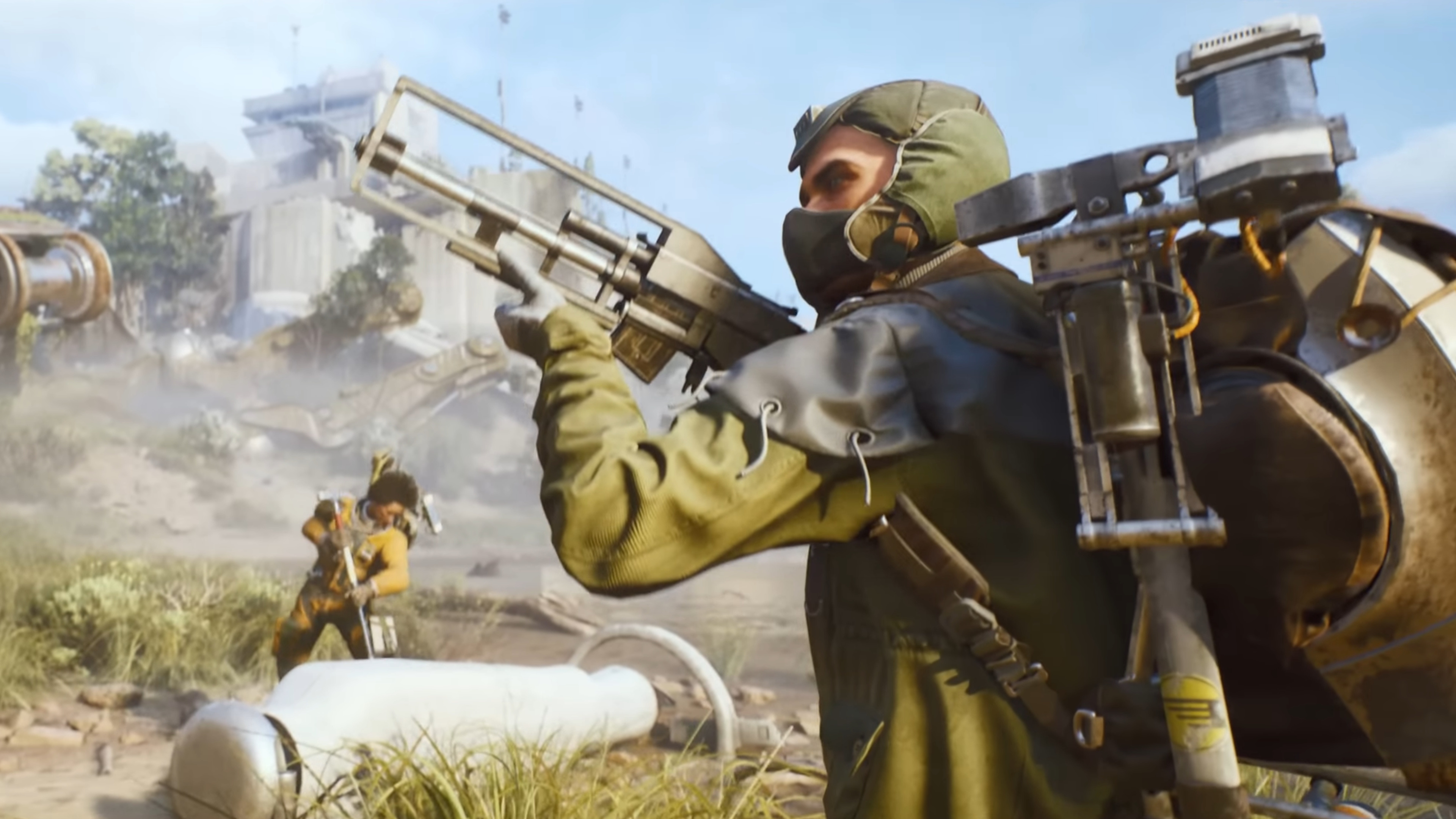 Arc Raiders trailer still - man aiming a gun off screen while a woman pries open a large cylinder