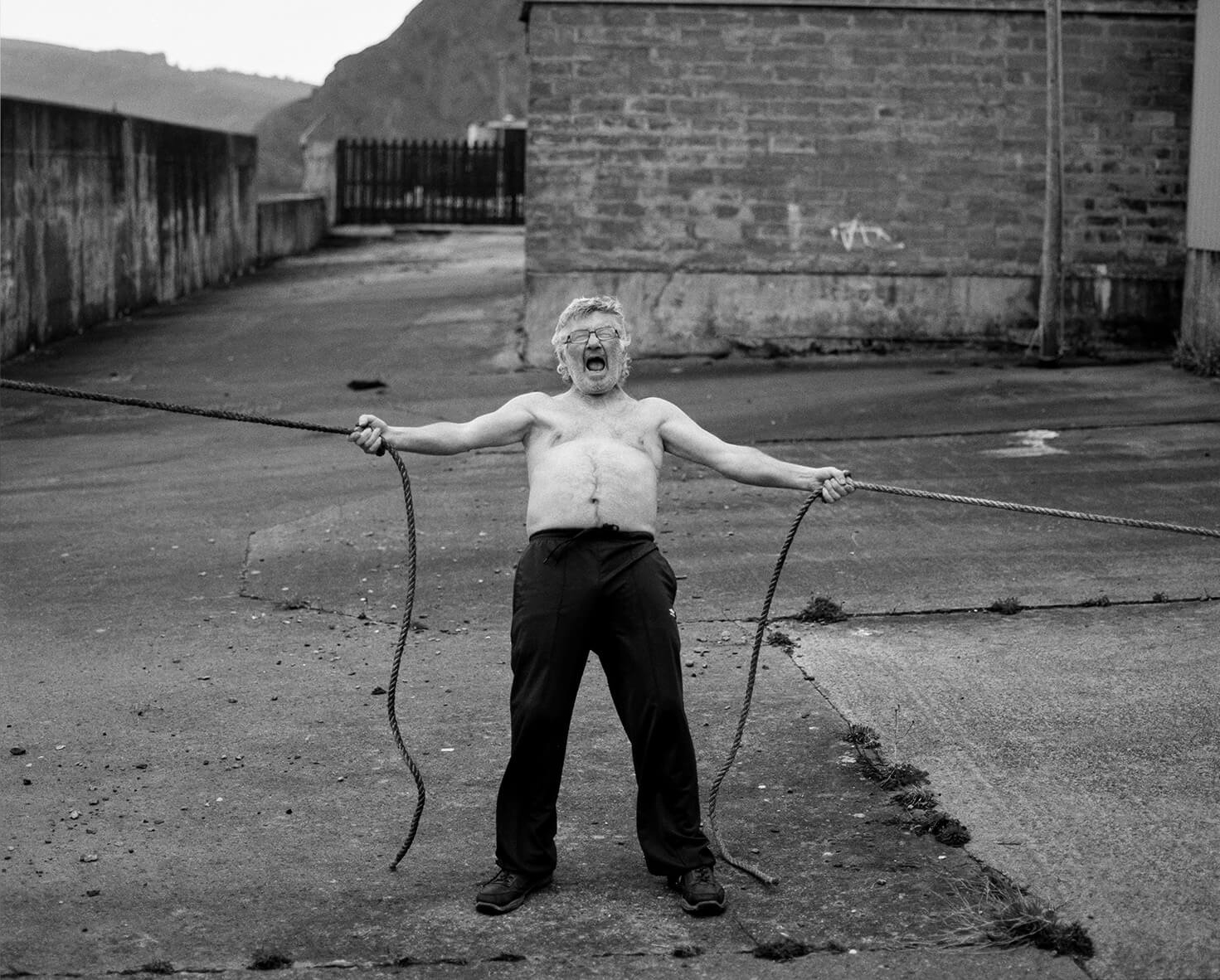 Man holding ropes aggressively