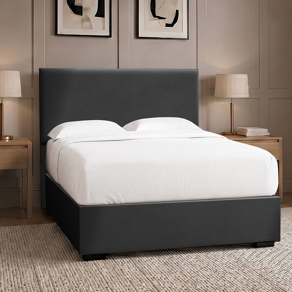Square upholstered bed frame in a taupe coloured bedroom