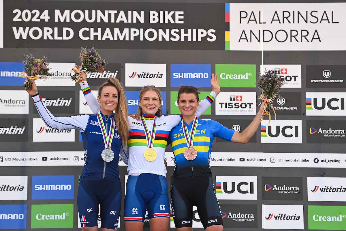 Picture by Will Palmer/SWpix.com - 30/08/2024 - Cycling - 2024 UCI Mountain Bike World Championships - Pal Arinsal, Arinsal, Andorra - Women&acirc;s Elite Cross-country Short Track Podium - Evie Richards (Great Britain) Gold Medalist and UCI World Champion, Pauline Ferrand Prevot (France) Silver Medalist and Jenny Rissveds (Sweden) Bronze Medalist