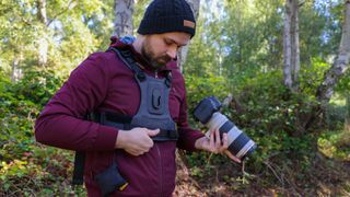 Cotton Carrier G3 worn by a man in a burgandy jacket outdoors in a woods