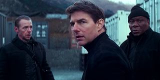 Mission: Impossible - Fallout Simon Pegg, Tom Cruise, and Ving Rhames in the field, looking rather concerned