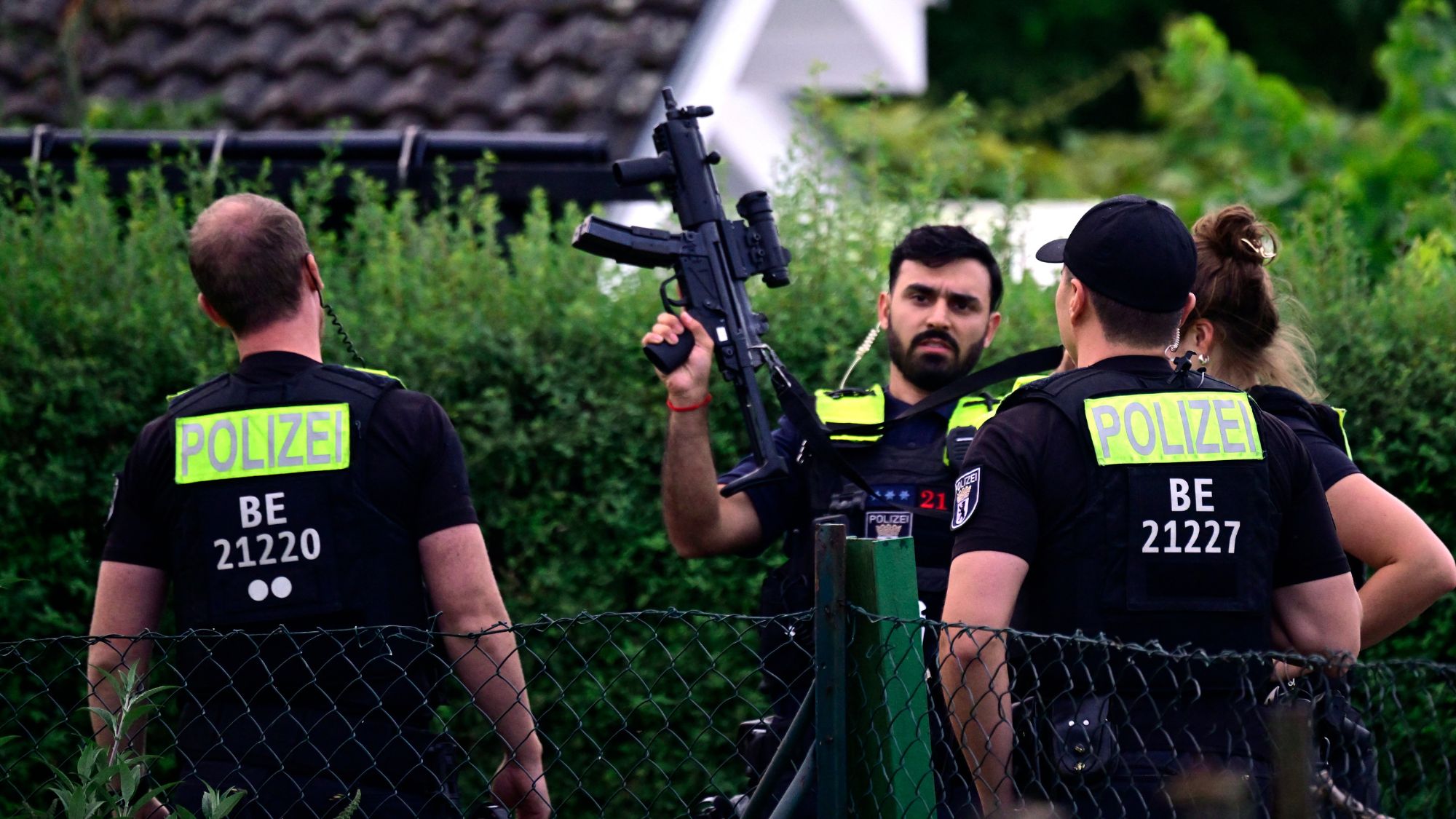 Police officers assemble near where the chief suspect in the previous nights' deadly attack near Berlin's Pride parade was shot dead