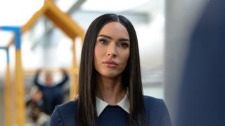 Alice (Megan Fox) looks to the right in the sci-fi movie "Subservience