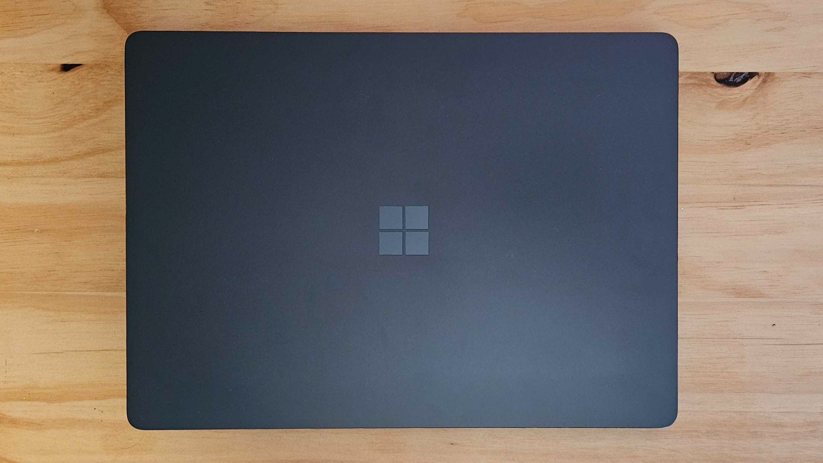 Microsoft Surface laptop on table (closed, view from above)