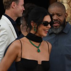 Kendall Jenner wears a sheer dress and Kylie Jenner wears a silver lace-up corset dress