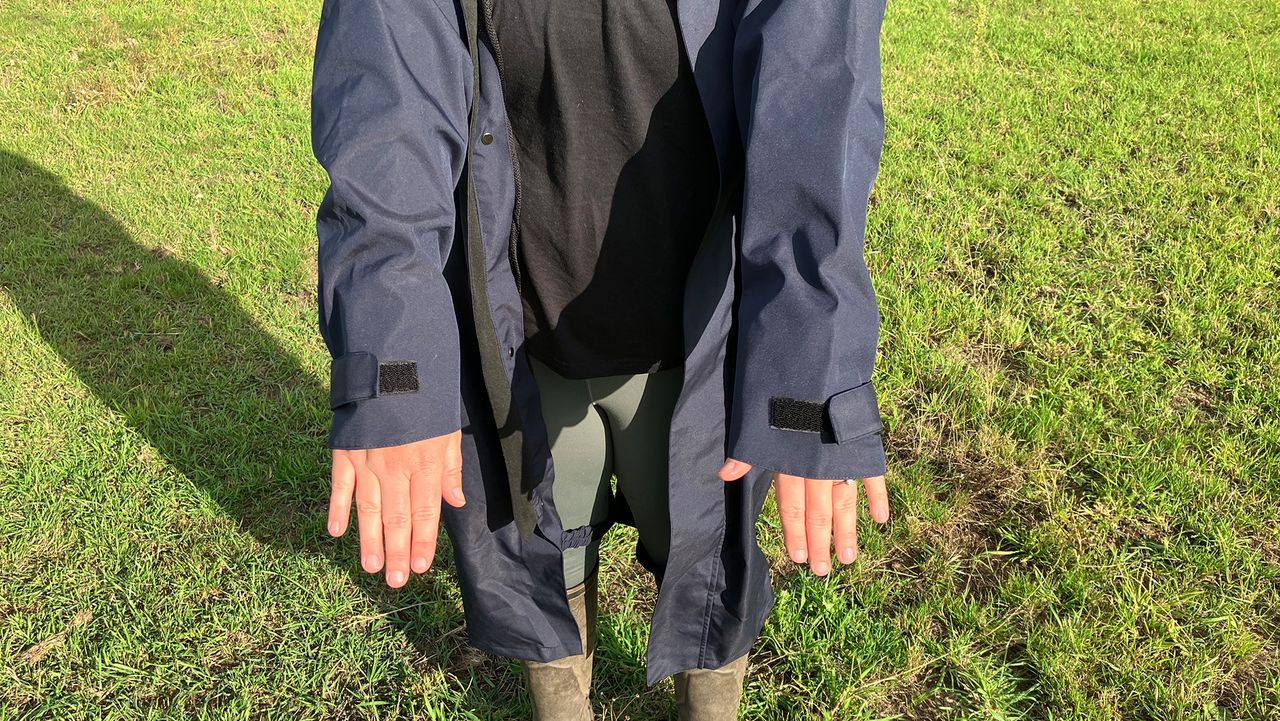 Lady wears Reincoat Lite, showing a close up of cuffs