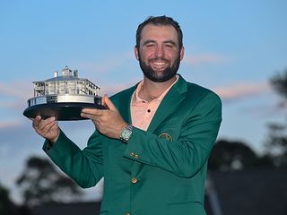 Scottie Scheffler with the Green Jacket and the trophy at The Masters