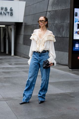 Woman in boho blouse and jeans