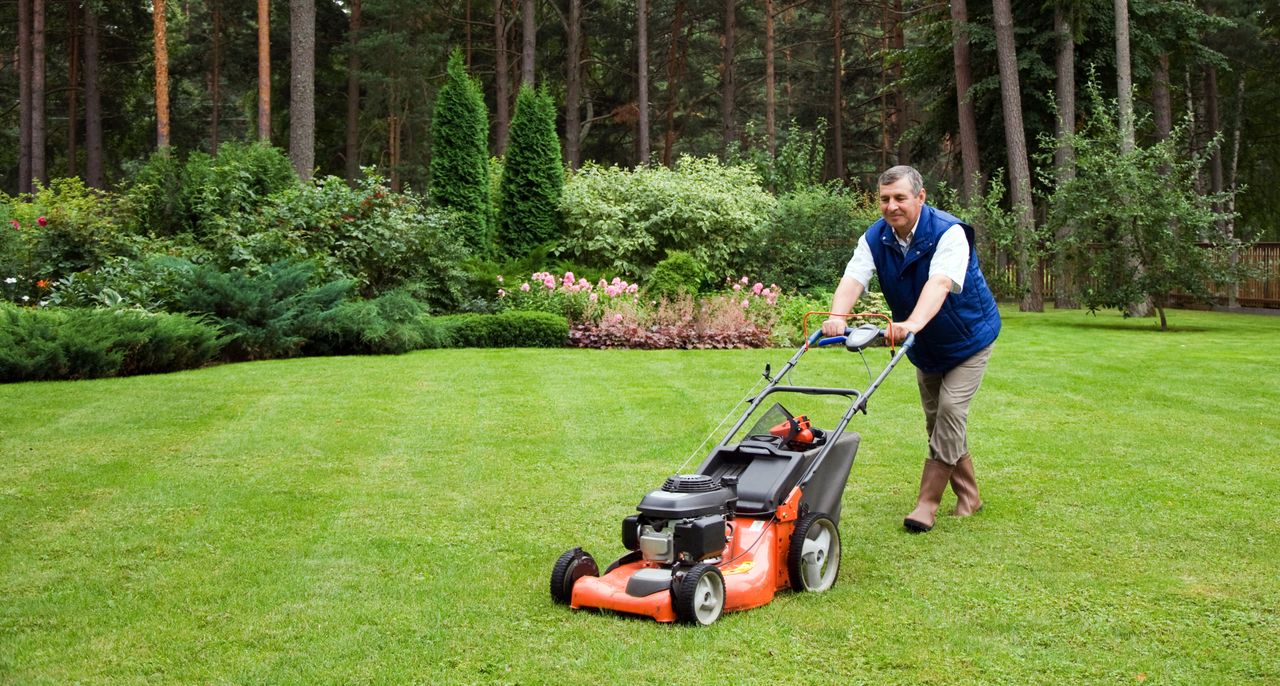 A man mowing the lawn.