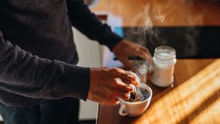 Person brewing a coffee