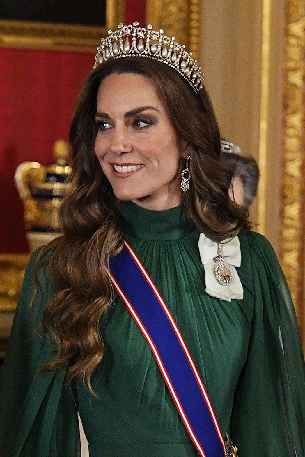 Princess Kate wearing a green gown and the Lover's Knot Tiara