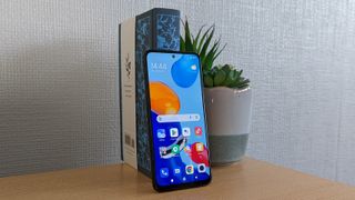 Xiaomi Redmi Note 11 face forwards with the screen on.