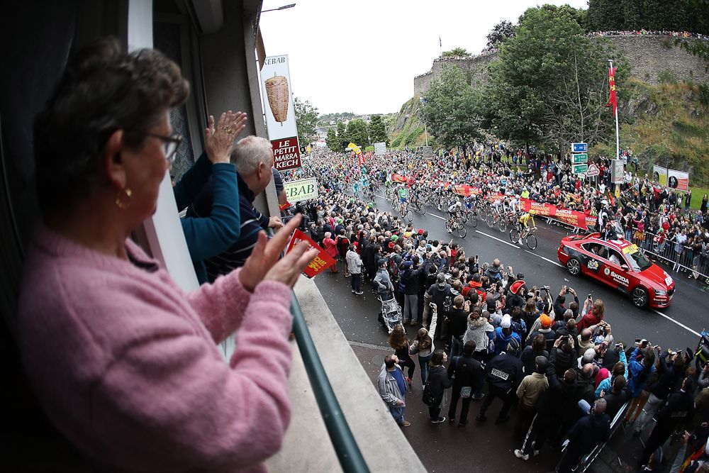 The peloton roll out of Saint-Lo at the start of stage two of the 2016 Tour de France