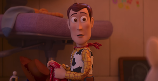 Woody looking back while his hat is off in Toy Story 5