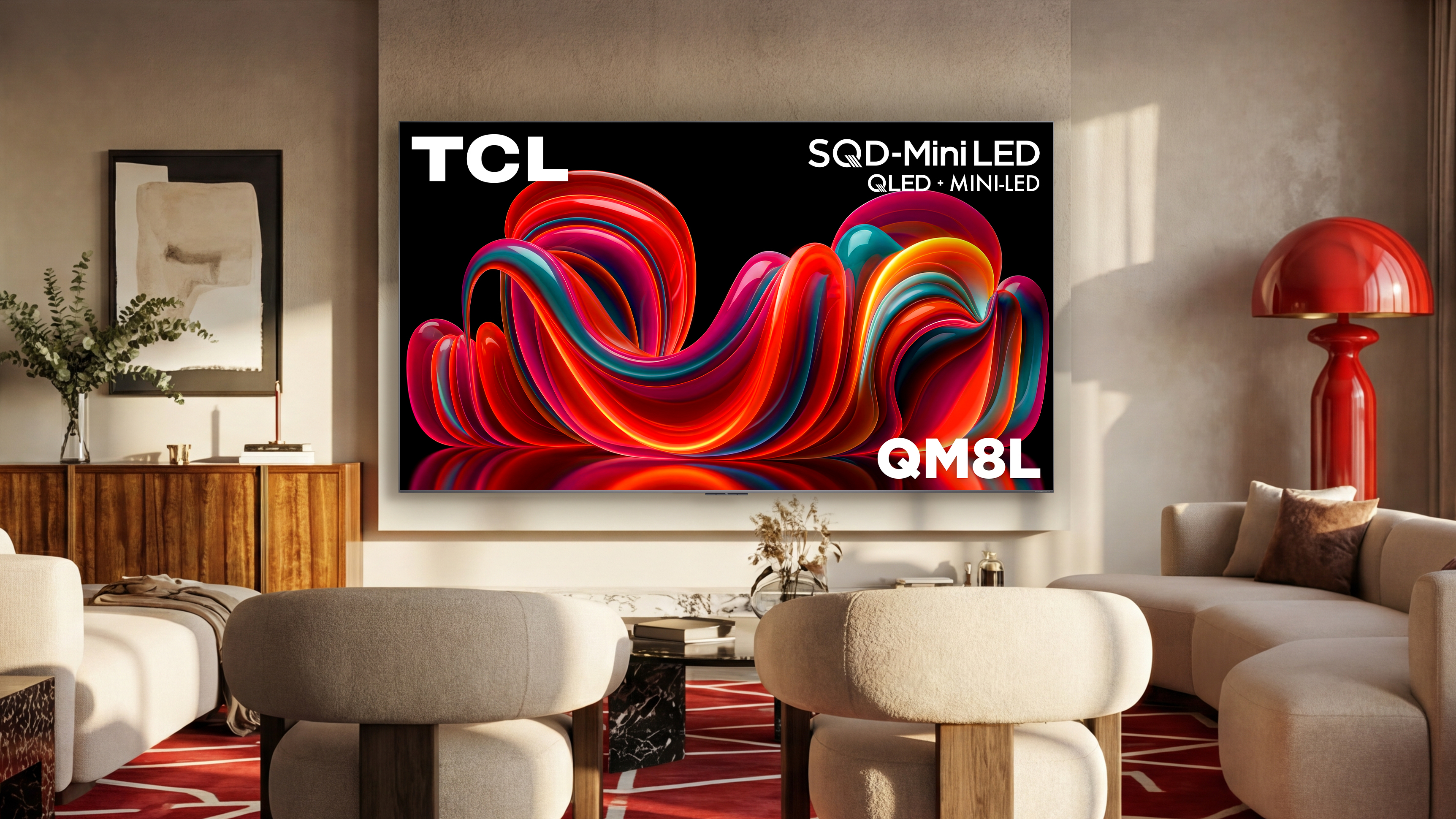 A wall-mounted TCL QM8L displaying colorful, abstract imagery in a well-lit living room