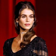 Kaia Gerber walks the red carpet at the Academy Museum Gala on Oct. 19 in a vintage Givenchy Couture gown referencing Audrey Hepburn's gown in My Fair Lady