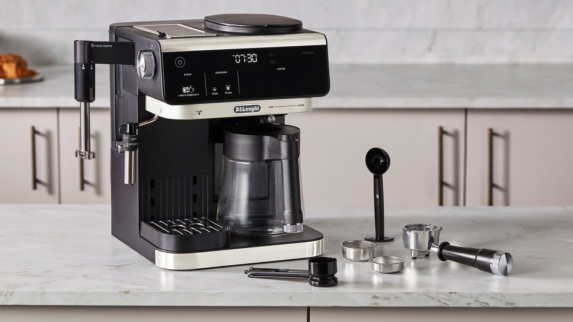 De'Longhi All-in-One Combination Coffee & Espresso Machine with accessories on kitchen counter