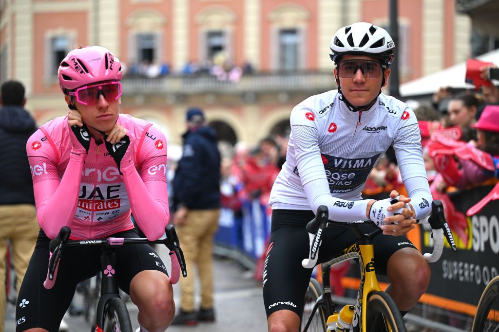 ACQUI TERME ITALY MAY 07 LR Tadej Pogacar of Slovenia and UAE Team Emirates Pink Leader Jersey and Cian Uijtdebroeks of Belgium and Team Visma Lease a Bike White Best Young Jersey prior to the 107th Giro dItalia 2024 Stage 4 a 190km stage from Acqui Terme to Andora UCIWT on May 07 2024 in Acqui Terme Italy Photo by Tim de WaeleGetty Images