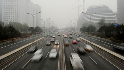 Thick smog driven by car emissions descends on Beijing 