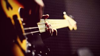 Close-up of a bass player's hands