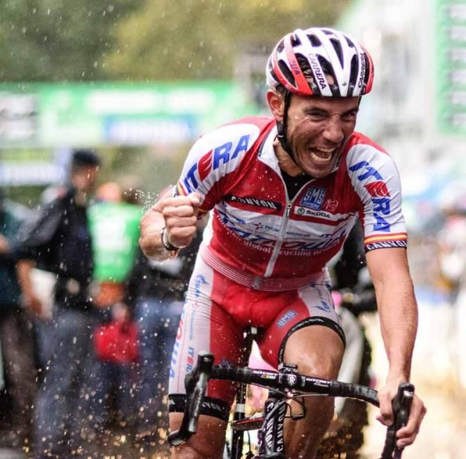 Joaquim Rodriguez loses his cool and howls for joy as he crosses the line to win his first ever Monument at Il Lombardia in a torrential downpour.