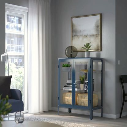 Dark blue metal and glass cabinet