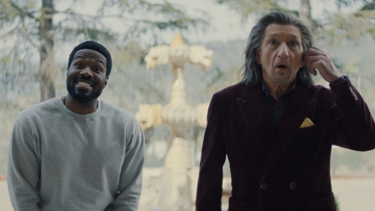 Simon smiling as Trevor is touching face in Wonder Man Season 1