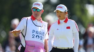 Ruoning Yin and her caddie at the Olympics