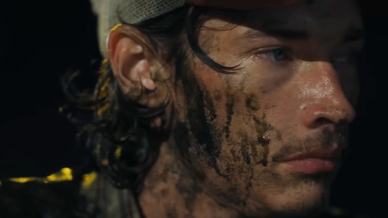 Cooper in Landman his face is covered in oil.