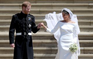 Prince Harry, Duke of Sussex and the Duchess of Sussex depart after their wedding ceremonyat St George's Chapel at Windsor Castle on May 19, 2018 in Windsor, England