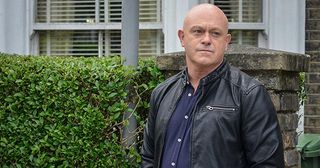 Grant Mitchell looks around the Square in EastEnders.