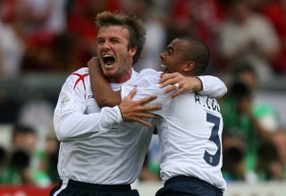 David Beckham celebrates with Ashley Cole after his free-kick winner for England against Ecuador at the 2006 World Cup.
