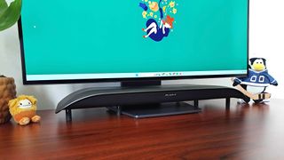 BlueAnt Soundblade tucked under LG monitor using extended feet