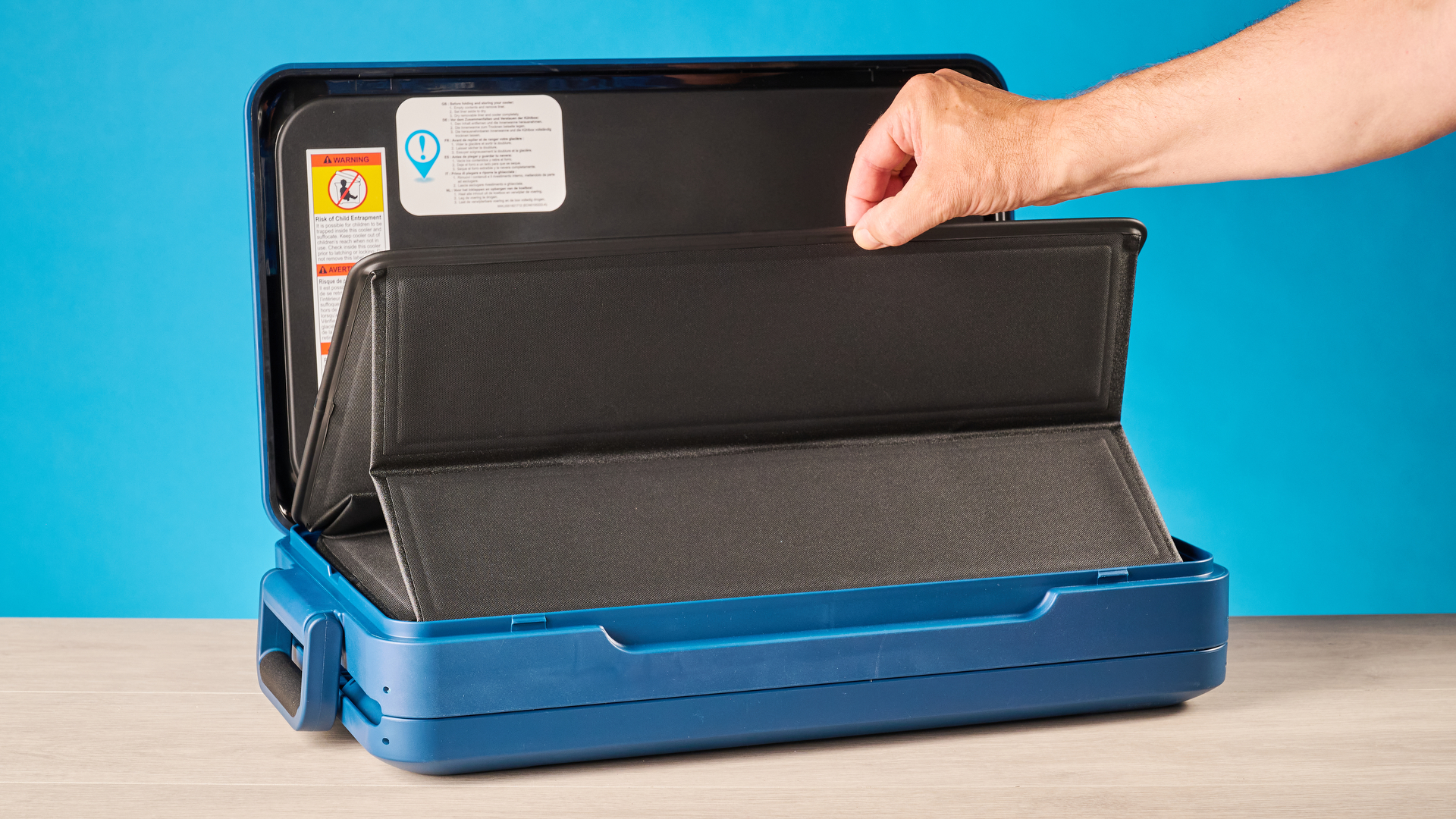 the coleman snap 'n go collapsible cooler photographed with the blue tom's guide background