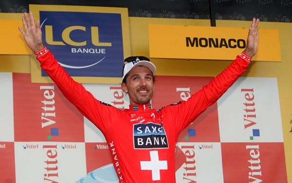 Swiss road champion Fabian Cancellara (Team Saxo Bank) on the podium for winning the Tour's first stage.