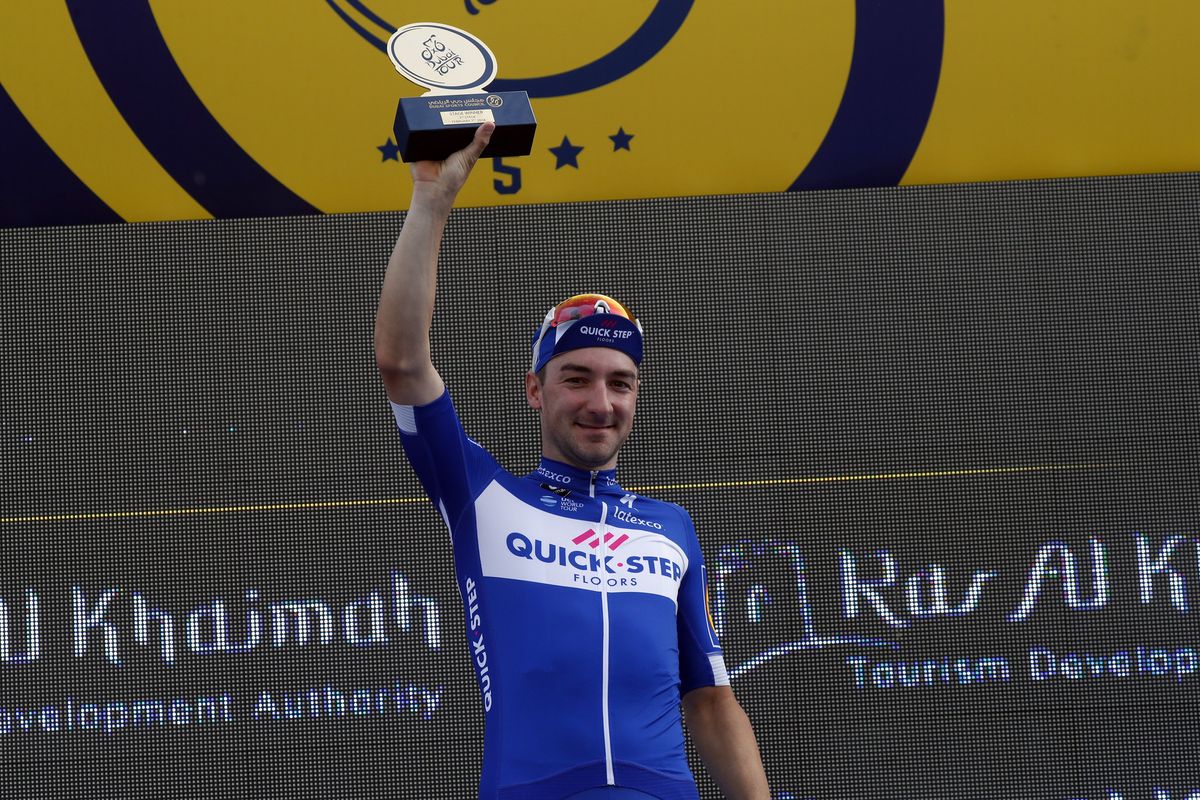 Elia Viviani gets his trophy for winning the stage