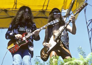 Gary Rossington and Leon Wilkeson perform with Lynyrd Skynyrd, July 1977