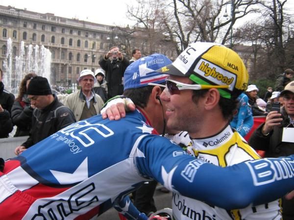Mates George Hincapie and Mark Cavendish embrace at the start