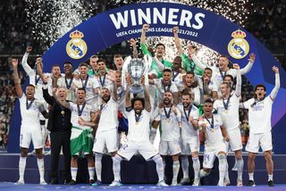 Real Madrid celebrate winning their 14th Champions League trophy after victory in Paris against Liverpool in May 2022.