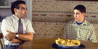 American Pie Jim and his dad sit at the table, smashed pie in front of them