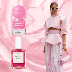 A woman in a pink outfit next to two bottles of pink nail polish