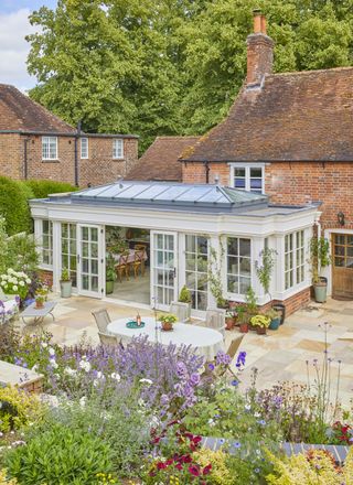 Pale sage glass house against home