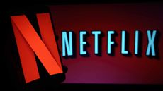 Netflix stock company logo on tv screen