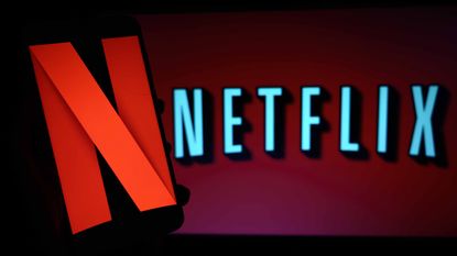 Netflix stock company logo on tv screen