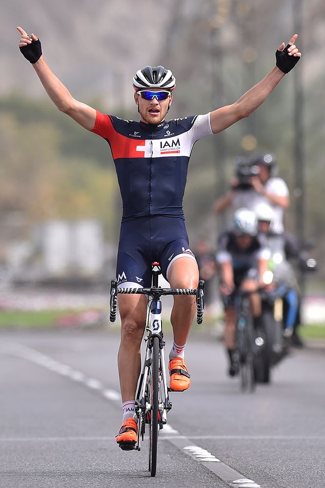 Matthias Br&auml;ndle (IAM Cycling) celebrates victory at the Tour of Oman.