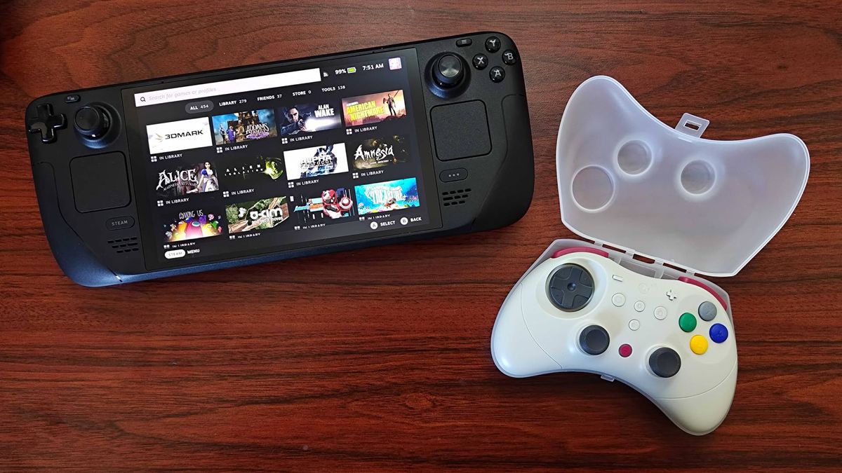 Gulikit Elves 2 Pro in open case text to Steam Deck OLED on woodgrain desk.