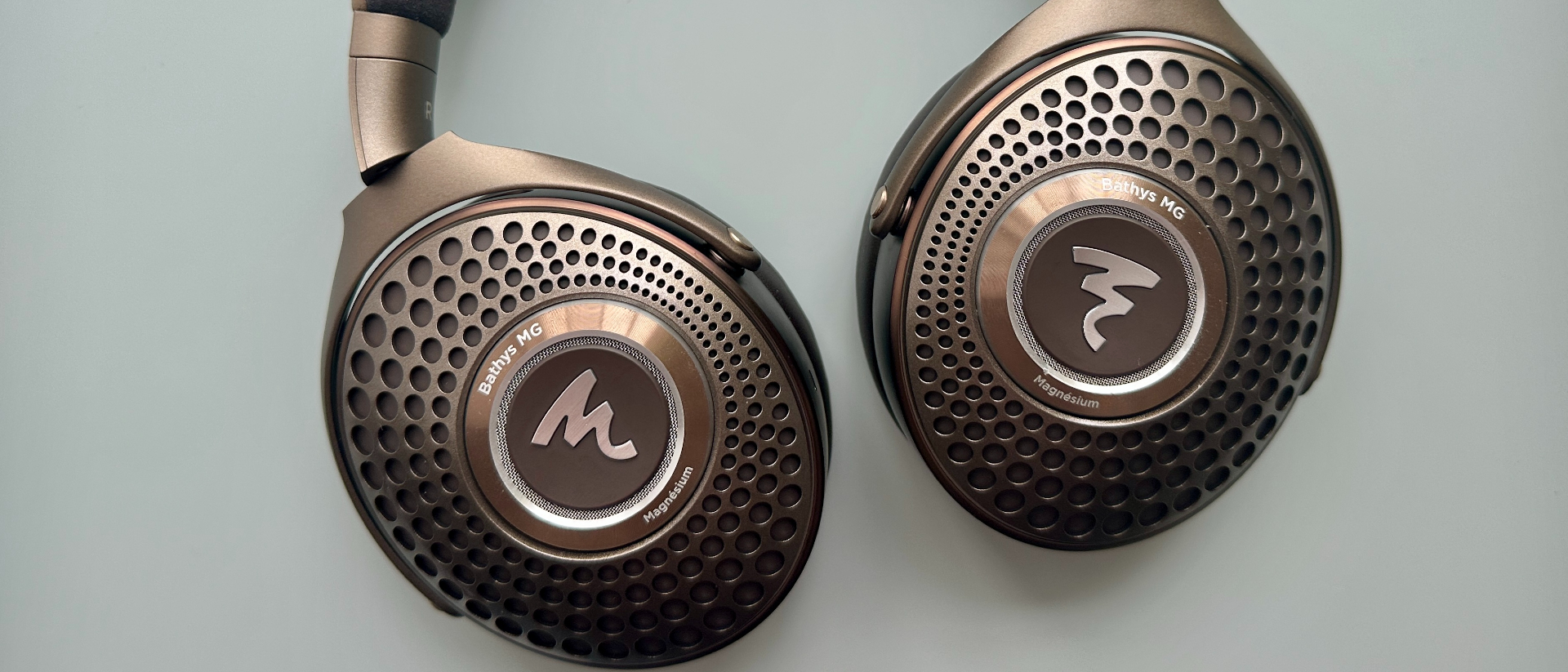 Focal Bathys MG headphones in bronze, on gray background