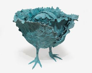 Sculpture of blue lettuce with chicken feet