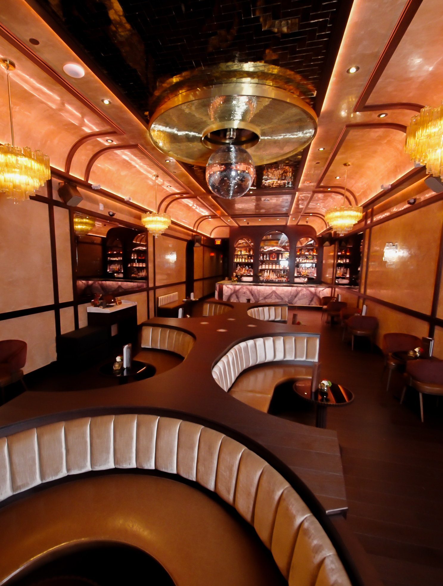A lavish restaurant and its speakeasy decked out for nighttime guests.